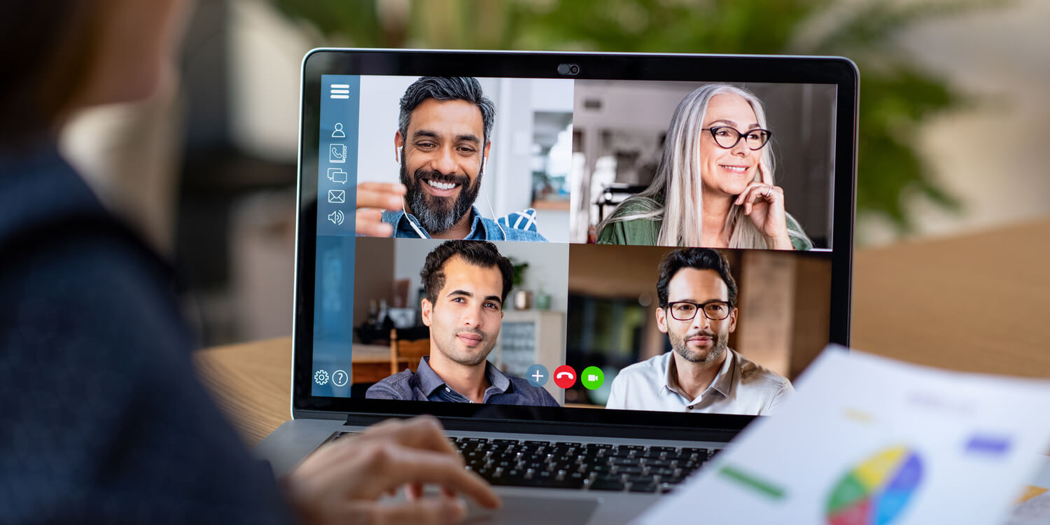 Image of laptop screen displaying 4 team members in a Zoom meeting.